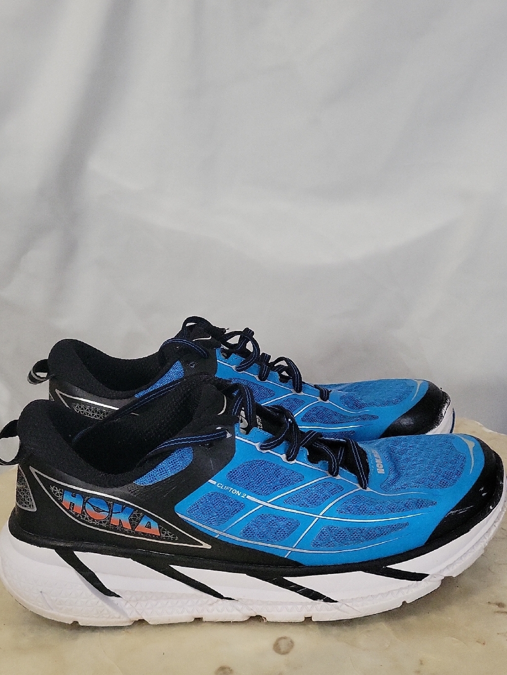 HOKA ONE ONE Clifton 2 running shoes in blue. 